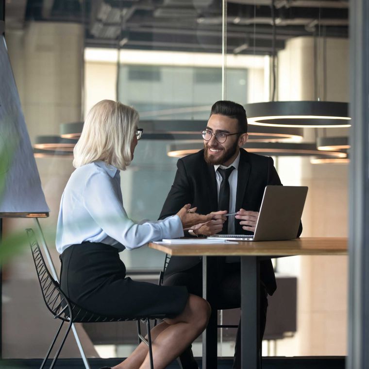 Business man and women having a positive friendly meeting.